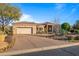 Home exterior with desert landscaping and garage at 19115 E Tonto Verde Dr, Rio Verde, AZ 85263