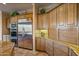 Kitchen features stainless steel appliances and ample wood cabinetry at 19115 E Tonto Verde Dr, Rio Verde, AZ 85263