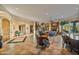 Open living room with stone fireplace and large windows at 19115 E Tonto Verde Dr, Rio Verde, AZ 85263