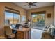 Home office with built-in desk and sliding glass door at 19115 E Tonto Verde Dr, Rio Verde, AZ 85263