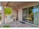 Outdoor kitchen with built-in grill and sliding glass doors at 19115 E Tonto Verde Dr, Rio Verde, AZ 85263