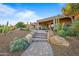 Pathway to the patio with desert landscaping at 19115 E Tonto Verde Dr, Rio Verde, AZ 85263