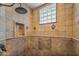 Walk-in shower with tile surround and glass block window at 19115 E Tonto Verde Dr, Rio Verde, AZ 85263