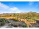 Elevated view of the backyard, golf course, and mountains at 19115 E Tonto Verde Dr, Rio Verde, AZ 85263