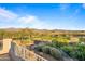 Scenic view of a golf course and mountains from a backyard patio at 19115 E Tonto Verde Dr, Rio Verde, AZ 85263