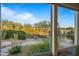 Window view of a landscaped backyard with desert plants at 19115 E Tonto Verde Dr, Rio Verde, AZ 85263