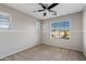 Bedroom with ceiling fan, carpet, and window coverings at 19359 E Canary Way, Queen Creek, AZ 85142