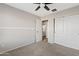 Bedroom with ceiling fan, carpet, and closet at 19359 E Canary Way, Queen Creek, AZ 85142