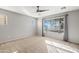 Bedroom with neutral walls, ceiling fan, and carpeted floors at 19359 E Canary Way, Queen Creek, AZ 85142