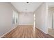 Empty dining room featuring wood-look floors and neutral walls at 19359 E Canary Way, Queen Creek, AZ 85142