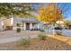 Two-story house with gray siding, fall foliage, and a driveway at 19359 E Canary Way, Queen Creek, AZ 85142