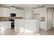 Galley kitchen with white cabinets, stone backsplash and stainless steel appliances at 19359 E Canary Way, Queen Creek, AZ 85142