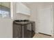 Laundry room with Samsung washer and dryer, plus cabinets at 19359 E Canary Way, Queen Creek, AZ 85142