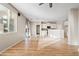 Open living room and kitchen area with hardwood floors at 19359 E Canary Way, Queen Creek, AZ 85142