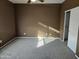 Spacious carpeted bedroom with ample natural light at 19422 N Smith Dr, Maricopa, AZ 85139