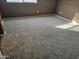 Well-lit bedroom with carpeted floors and window at 19422 N Smith Dr, Maricopa, AZ 85139