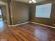 Dining room features wood-look floors and large window at 19422 N Smith Dr, Maricopa, AZ 85139