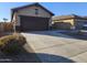 A two-car garage with a concrete driveway at 19422 N Smith Dr, Maricopa, AZ 85139