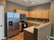 Kitchen with stainless steel appliances and wood cabinets at 19422 N Smith Dr, Maricopa, AZ 85139