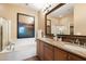 Bathroom with double vanity and a soaking tub at 19475 N Grayhawk Dr # 2169, Scottsdale, AZ 85255