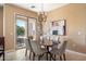 Elegant dining room with chandelier and hardwood table at 19475 N Grayhawk Dr # 2169, Scottsdale, AZ 85255