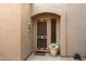 Inviting entryway with security door and potted plant at 19475 N Grayhawk Dr # 2169, Scottsdale, AZ 85255