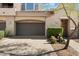 Home's exterior features a two-car garage and landscaping at 19475 N Grayhawk Dr # 2169, Scottsdale, AZ 85255