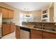 Eat-in kitchen with granite countertops and double sink at 19475 N Grayhawk Dr # 2169, Scottsdale, AZ 85255