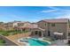 Aerial view of two story house with pool and backyard at 19538 N Crestview Ln, Maricopa, AZ 85138