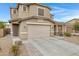 Two story house exterior with attached two car garage at 19538 N Crestview Ln, Maricopa, AZ 85138