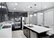 Kitchen with island, stainless steel appliances, and dark cabinets at 19538 N Crestview Ln, Maricopa, AZ 85138