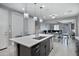 Modern kitchen with island, stainless steel appliances, and ample counter space at 19538 N Crestview Ln, Maricopa, AZ 85138