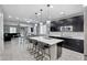 Kitchen with island, stainless steel appliances, and dark cabinets at 19538 N Crestview Ln, Maricopa, AZ 85138