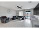 Comfortable living room boasts sectional sofa and sliding doors to patio at 19538 N Crestview Ln, Maricopa, AZ 85138