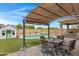 Covered patio with seating area and string lights at 19538 N Crestview Ln, Maricopa, AZ 85138