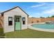 Charming playhouse with a green door at 19538 N Crestview Ln, Maricopa, AZ 85138