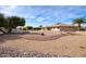 Large backyard with gravel and desert landscaping, offering a view of the home at 19607 N Conquistador Dr, Sun City West, AZ 85375