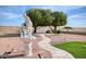 Landscaped backyard with fountain and seating area at 19607 N Conquistador Dr, Sun City West, AZ 85375