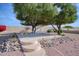 Landscaped backyard with a cozy patio setting at 19607 N Conquistador Dr, Sun City West, AZ 85375