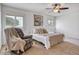 Bright bedroom with ceiling fan and neutral decor at 19607 N Conquistador Dr, Sun City West, AZ 85375