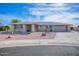 Single-story home with desert landscaping and a two-car garage at 19607 N Conquistador Dr, Sun City West, AZ 85375