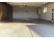 Two-car garage with built-in cabinets and epoxy flooring at 19607 N Conquistador Dr, Sun City West, AZ 85375