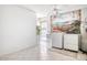 Bright laundry room with washer, dryer, sink, and tiled floor at 19607 N Conquistador Dr, Sun City West, AZ 85375