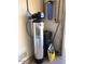 Whole-house water softener system installed in the garage at 19607 N Conquistador Dr, Sun City West, AZ 85375