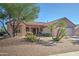 Single-story home with desert landscaping and a two-car garage at 20055 N Siesta Rock Dr, Surprise, AZ 85374