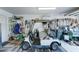 Garage with golf cart, storage shelving, and various tools at 20055 N Siesta Rock Dr, Surprise, AZ 85374