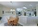 Modern kitchen with light grey cabinets, quartz countertops, and breakfast bar at 20055 N Siesta Rock Dr, Surprise, AZ 85374