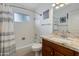 Simple bathroom with tub, shower, and granite countertop at 2011 E La Jolla Dr, Tempe, AZ 85282