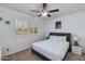 Bedroom with a queen bed, window shutters, and ceiling fan at 2011 E La Jolla Dr, Tempe, AZ 85282