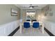 Dining room features a square table with blue chairs and a rug at 2011 E La Jolla Dr, Tempe, AZ 85282